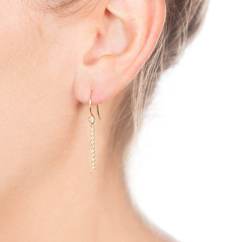 Diamond Bubble Bar Drop Earrings on Person