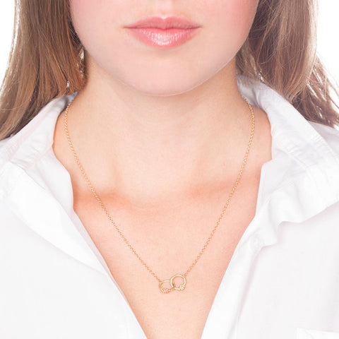 Interlocking Gold Necklace with Diamonds on Person